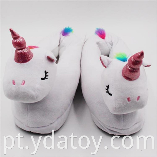 Plush white unicorn slippers